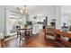 Cozy eat-in kitchen featuring white cabinetry, a breakfast nook, and stainless steel appliances at 4035 Crabapple Lake Ct, Roswell, GA 30076