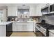 Stylish kitchen with stainless steel appliances, white cabinets, and great natural lighting at 4035 Crabapple Lake Ct, Roswell, GA 30076