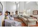 Spacious living room featuring high ceilings, a fireplace, and hardwood floors at 4035 Crabapple Lake Ct, Roswell, GA 30076