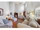 Comfortable living room showcasing high ceilings, a fireplace, and hardwood flooring at 4035 Crabapple Lake Ct, Roswell, GA 30076