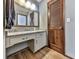 Bathroom with granite countertop and wood vanity at 6790 Fairways Dr, Douglasville, GA 30134