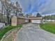 House exterior with attached two-car garage at 6790 Fairways Dr, Douglasville, GA 30134