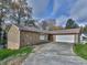 House exterior with attached two-car garage at 6790 Fairways Dr, Douglasville, GA 30134