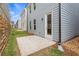 Private backyard with a concrete patio and gray siding at 702 Smokey Quartz Way, Kennesaw, GA 30144