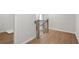 Upstairs hallway with wood floors and staircase at 702 Smokey Quartz Way, Kennesaw, GA 30144