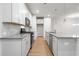 Modern kitchen with white shaker cabinets, gray countertops, and stainless steel appliances at 702 Smokey Quartz Way, Kennesaw, GA 30144