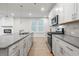 Modern kitchen with stainless steel appliances and island at 702 Smokey Quartz Way, Kennesaw, GA 30144