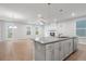 Modern kitchen with island and stainless steel appliances at 702 Smokey Quartz Way, Kennesaw, GA 30144