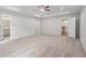 Main bedroom with carpet, ceiling fan and access to bathroom and hallway at 702 Smokey Quartz Way, Kennesaw, GA 30144