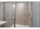 Shower with glass enclosure and beige tile at 702 Smokey Quartz Way, Kennesaw, GA 30144