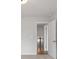 View of an open upper hallway with carpeted floor and wooden railing at 702 Smokey Quartz Way, Kennesaw, GA 30144