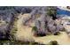 Expansive lot showcasing potential home site near a serene pond and mature trees at 866 Lee Byrd Rd, Loganville, GA 30052