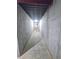 Unfinished basement hallway showcasing concrete walls and ceiling, ready for customization at 866 Lee Byrd Rd, Loganville, GA 30052