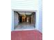 View of the unfinished basement with concrete floor and open garage at 866 Lee Byrd Rd, Loganville, GA 30052