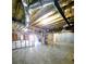 Spacious unfinished basement with concrete floor, exposed ceiling, and rough framing at 866 Lee Byrd Rd, Loganville, GA 30052