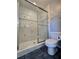 Well-maintained bathroom includes a shower with sliding glass door at 866 Lee Byrd Rd, Loganville, GA 30052