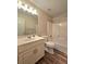 Bathroom with wood-style flooring and a shower-tub combo at 866 Lee Byrd Rd, Loganville, GA 30052