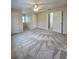 Bedroom features a ceiling fan, window, and neutral-toned walls at 866 Lee Byrd Rd, Loganville, GA 30052