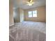 Cozy bedroom features a ceiling fan, window, and neutral-toned walls at 866 Lee Byrd Rd, Loganville, GA 30052