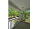 Covered patio providing an outdoor retreat with views of lush greenery at 866 Lee Byrd Rd, Loganville, GA 30052