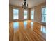 Sun-filled dining room with hardwood floors and large windows at 866 Lee Byrd Rd, Loganville, GA 30052