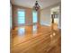 Dining room with hardwood floors, chandelier and bright natural light at 866 Lee Byrd Rd, Loganville, GA 30052