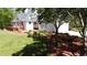 Lovely home featuring a deck, verdant landscaping, and an attached garage at 866 Lee Byrd Rd, Loganville, GA 30052