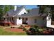 Charming home with a deck, lush landscaping, and a two-car garage at 866 Lee Byrd Rd, Loganville, GA 30052