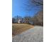 View of home exterior and front yard on a sunny day at 866 Lee Byrd Rd, Loganville, GA 30052