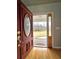 Elegant wood front door with decorative glass and stylish hardware at 866 Lee Byrd Rd, Loganville, GA 30052