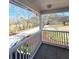 Covered front porch with white railings and a view of the front yard at 866 Lee Byrd Rd, Loganville, GA 30052