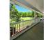 Spacious porch overlooking a well-maintained lawn and verdant surroundings at 866 Lee Byrd Rd, Loganville, GA 30052