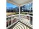 Covered front porch with white railings and a view of the front yard at 866 Lee Byrd Rd, Loganville, GA 30052