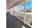 Covered front porch with white railings and a view of the front yard at 866 Lee Byrd Rd, Loganville, GA 30052