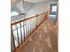 Hallway with wooden railing overlooking the living room and foyer at 866 Lee Byrd Rd, Loganville, GA 30052
