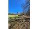 Scenic view of land with blue sky, trees, and storage building at 866 Lee Byrd Rd, Loganville, GA 30052