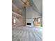 Open-concept living room features fireplace and balcony from second story at 866 Lee Byrd Rd, Loganville, GA 30052