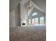 Open living room features vaulted ceilings, fireplace and lots of natural light at 866 Lee Byrd Rd, Loganville, GA 30052