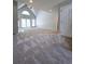 Open-concept living room features vaulted ceiling and lots of natural light at 866 Lee Byrd Rd, Loganville, GA 30052