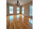 Bright living room boasts hardwood floors and multiple windows at 866 Lee Byrd Rd, Loganville, GA 30052