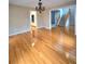 Open living room with stairs to second story and hardwood floors at 866 Lee Byrd Rd, Loganville, GA 30052