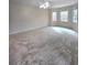 Expansive main bedroom with plush carpet, multiple windows and neutral walls at 866 Lee Byrd Rd, Loganville, GA 30052