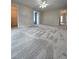Large main bedroom boasts wall-to-wall carpet, access to walk-in closet, and neutral decor at 866 Lee Byrd Rd, Loganville, GA 30052