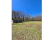 Spacious two door shed with a large open grass field at 866 Lee Byrd Rd, Loganville, GA 30052