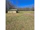 Single door storage building at the edge of a grassy field at 866 Lee Byrd Rd, Loganville, GA 30052