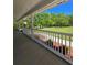 Inviting front porch with white railing overlooks the lawn and garden at 866 Lee Byrd Rd, Loganville, GA 30052