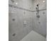 Elegant shower with light tile and a stylish showerhead at 866 Lee Byrd Rd, Loganville, GA 30052