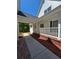 Side porch entrance with a walkway, offering seamless outdoor-indoor transitions at 866 Lee Byrd Rd, Loganville, GA 30052