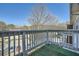 Relaxing outdoor balcony overlooking the parking lot with lots of trees in the background at 1342 Orchard Park Dr, Stone Mountain, GA 30083