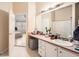 Well-lit bathroom with a vanity, ample counter space, and access to the bedroom at 1342 Orchard Park Dr, Stone Mountain, GA 30083